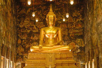 Buddha gold statue with thai art architecture in church Wat Suthat temple. This is a Buddhist temple in Bangkok .
