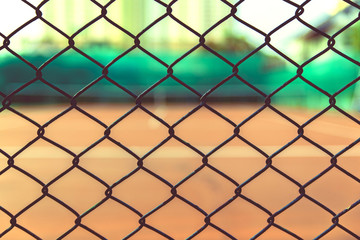 Fototapeta premium steel mesh with tennis court outside