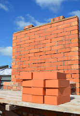 Concept Brick Laying with Brick Wall. Bricklaying Brick Wall House Construction Site Concept. Brick Wall Building Site.