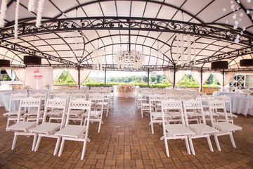 Wooden chairs at the wedding ceremony