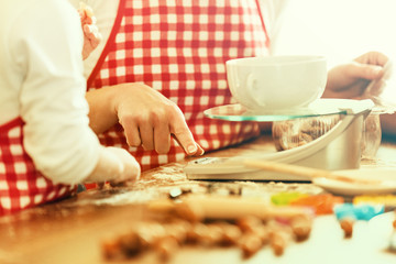 Mum an daughter measuring ingredients.