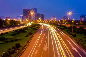 Hanoi cityscape at Thang Long multiple land highway at night. Focus on the highway