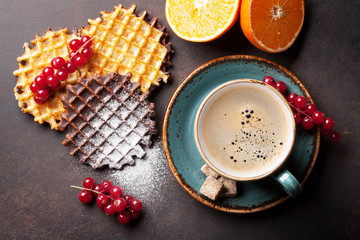 Coffee and waffles with berries