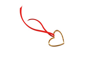 Pendant in the shape of a heart. Golden necklace. Gift
