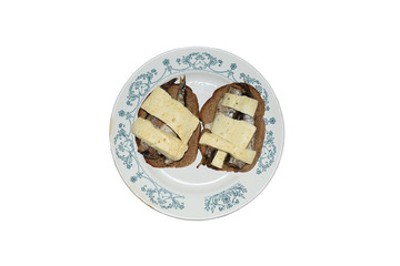 Plate with sandwiches of cheese and sprats