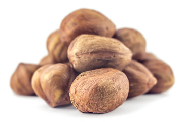 A bunch of hazelnuts on a white background. Raw hazelnuts isolated on white background