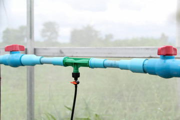 Red plastic valve for control the water flow used in agriculture.