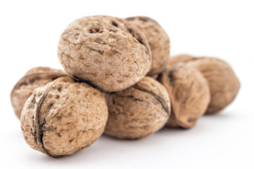 Assortment of dried walnuts isolated on the white background