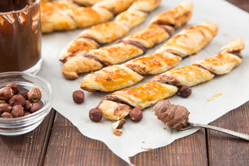 homemade cakes - puff pastry with chocolate paste. twisted cakes