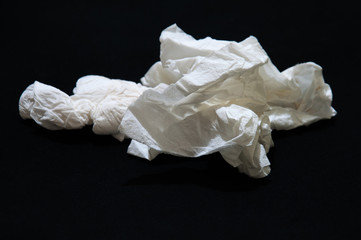 used paper tissue isolated on balck