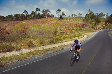 Obraz premium Asian men are cycling road bike in the morning
