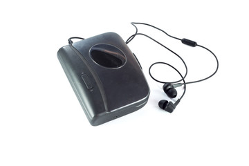 Cassette player and black earphones isolated