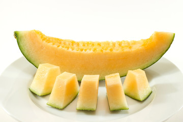 Fototapeta na wymiar Fresh melons sliced on plate 