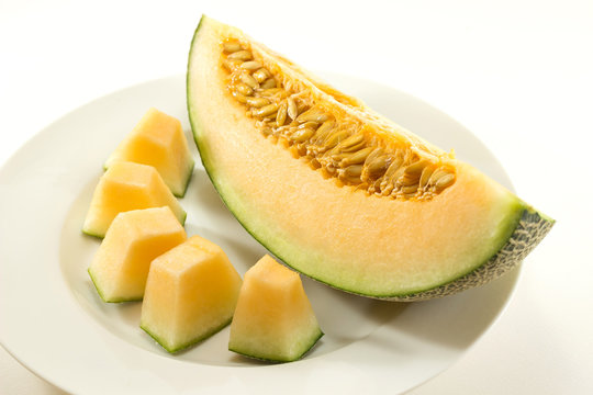 Fresh melons sliced on plate 