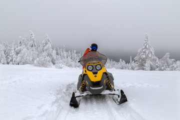 Athlete on a snowmobile