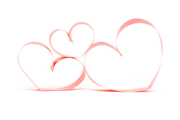Valentines day card - heart made of ribbon on white background.