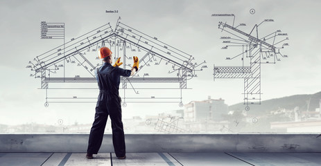 Builder man using media interface . Mixed media