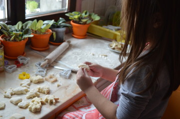 The girl says the cakes in the kitchen