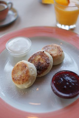 breakfast with cheesecakes on the table in a restaurant