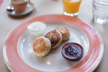 breakfast with cheesecakes on the table in a restaurant