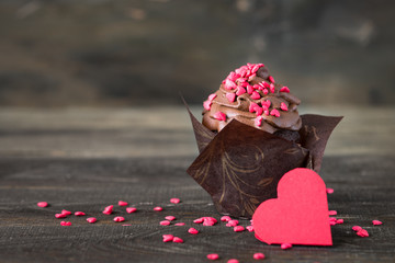 Chocolate cupcake with whipped cream for Valentine's Day