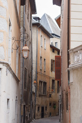 lantern on a background of the lane with old houses. Alley in the city center with its old houses. The European style architecture of the city center. France