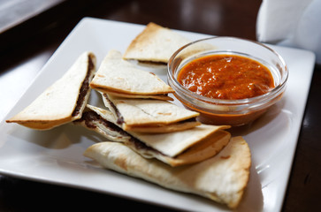 rosette with sauce and pretzels to beer