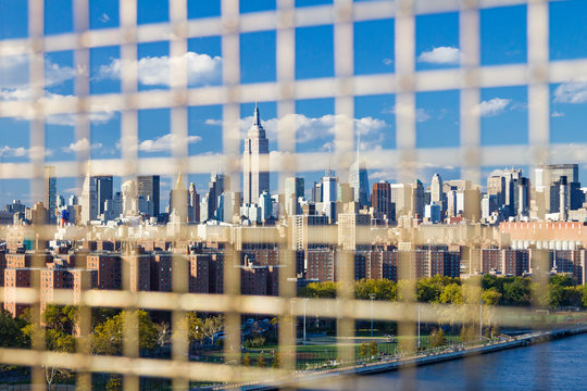 Fototapeta NYC Downtown Skyline Seen Through a Fence