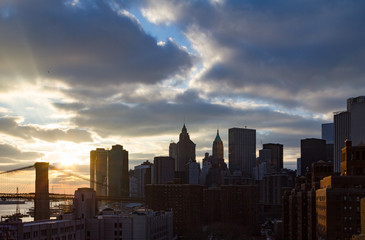 Fototapeta na wymiar Sunset Behind New York City Skyline Skyscrapers at Dusk