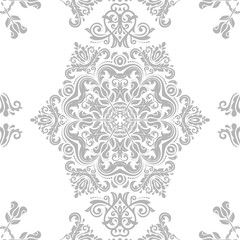 Seamless damask pattern. Traditional classic orient ornament. Light silver pattern
