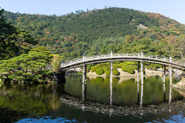 Japanese Ritsurin Garden and wooden bridge