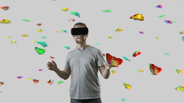 Man with VR gear glasses within butterfly cloud interactive touch virtual butterfly white