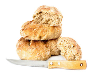 homemade loaf with bread knife over white
