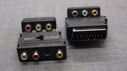 Male SCART AV black plastic adaptor isolated over the white background, set of three different...