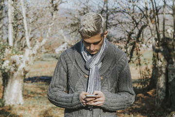 Fototapeta premium young teen fashion with the mobile outdoor