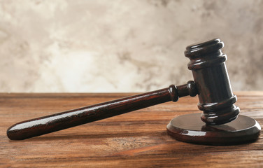 Court gavel and sound block on table