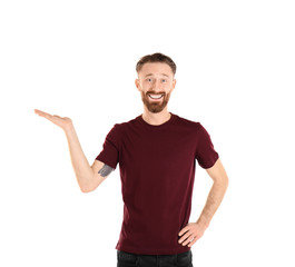 Young handsome man in claret red T-shirt isolated on white