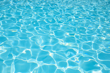 Blue and bright ripple water and surface in swimming pool