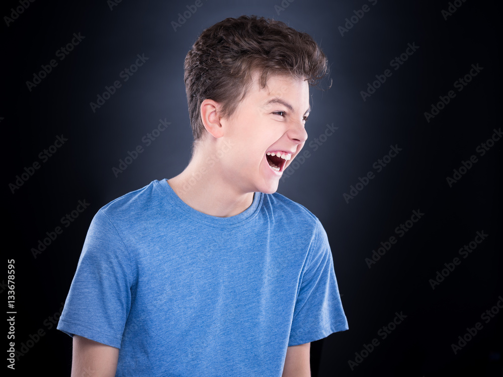 Wall mural Emotional portrait of teen boy