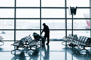 Passenger silhouette in the modern airport