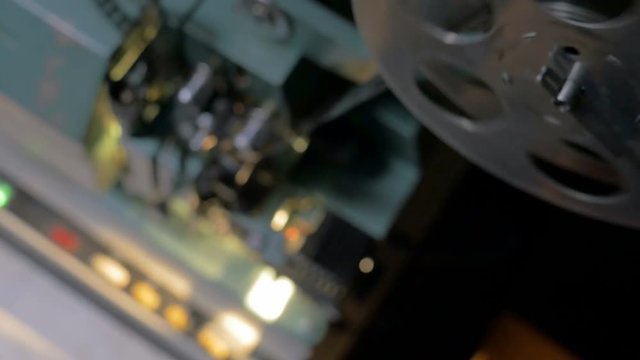 Working parts of an old vintage film projector. Dolly shot. 4K.