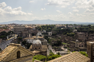 Obraz premium Rome overview with monument and several streets, roofs, domes, Coliseum, Imperial Forum, Rome, Italy