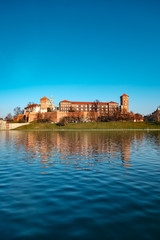 Fototapeta premium Famous landmark Wawel castle seen from Vistula, Krakow, Poland.