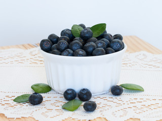 Fresh orgarnic blueberries in  white bowl