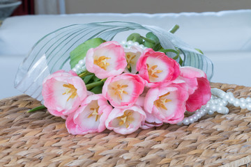 fresh pink tulips on wicker basket