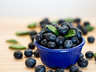 Fresh berries in a blue bowl