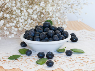 Fresh orgarnic blueberries in  white bowl