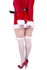 Beautiful sexy girl wearing santa claus clothes isolated on white background