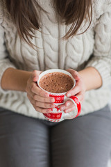 Woman hands holding a Cup of hot cocoa or  chocolate for  background, traditional drink  the winter time, lifestyle photos, top view