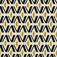Ethnic seamless pattern in black and gold on cream background. - 133690971